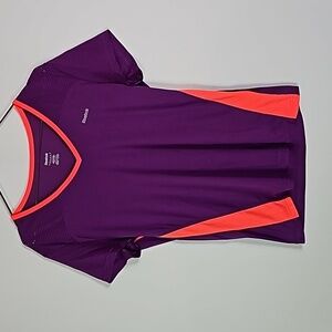 Reebok medium purple and orange playdry versacool athletic short sleeve shirt